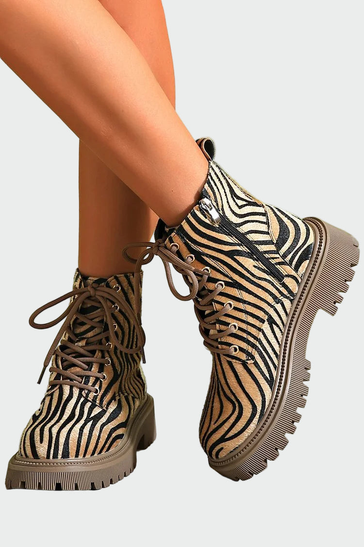 Lace-up boots in zebra design